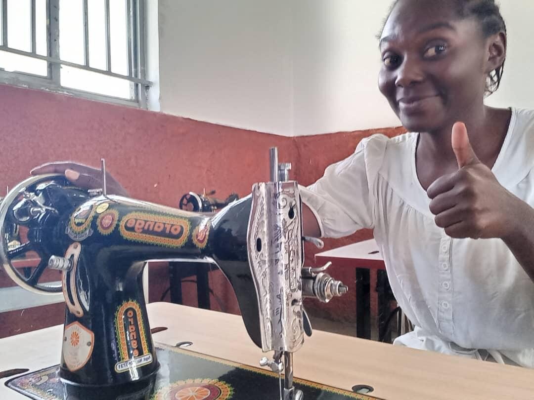 Esther Project graduates receiving sewing machines