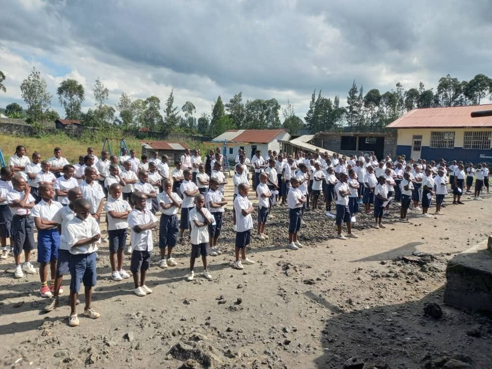 Primary school pupils lined up in uniform